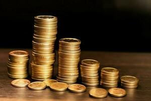 Stacks of savings coin arranged in ascending order on wooden working table or high coin towers representing the richness concept by AI Generated photo