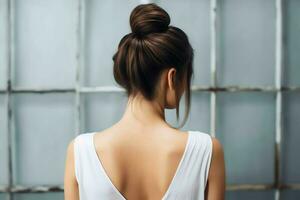 A beautiful bride with a bun hairstyles for long hair look from back. A female hairstyle rear view concept by AI Generated photo