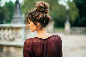 A beautiful bride with a bun hairstyles for long hair look from back. A female hairstyle rear view concept by AI Generated photo