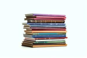 A book pile close up on a table. Front view pile book. For festival of world book day, national book day or national education day. Stack of colorful books on white background by AI Generated photo