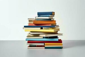 A book pile close up on a table. Front view pile book. For festival of world book day, national book day or national education day. Stack of colorful books on white background by AI Generated photo