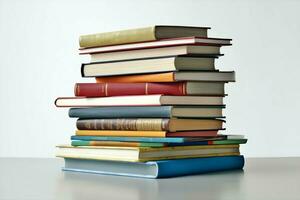 A book pile close up on a table. Front view pile book. For festival of world book day, national book day or national education day. Stack of colorful books on white background by AI Generated photo