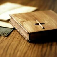 Close up of a holy bible and christian cross on wooden table. Happy good friday or religion concept by AI Generated photo