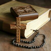 Close up of a holy bible and christian cross on wooden table. Happy good friday or religion concept by AI Generated photo