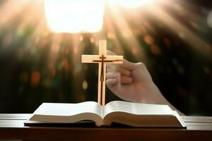 cerca arriba de un santo Biblia y cristiano cruzar en de madera mesa. contento bueno viernes o religión concepto por ai generado foto