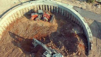 a construction site with a bulldozer and a tractor video