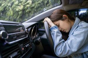 Tired young woman sleep in car, Hard work causes poor health, overworked concept photo