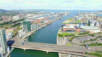 Aerial view on river and buildings in City centre of Belfast Northern Ireland. Drone photo, high angle view of town video
