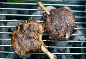 grilled pig wings - sliced open pork knuckle of a young pig photo