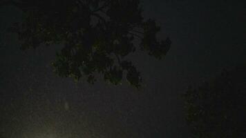 Heavy rain fell in the dark sky beneath a building. video