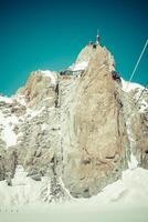 View of the rock of Aiguille du Midi, mont-Blanc, France, by beautiful weather photo