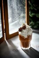 Glass of hot chocolate with whipped cream. Sugar powder snow. Cozy winter still life photography. photo