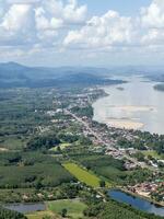 Above view of the border town in the valley along the large river. photo