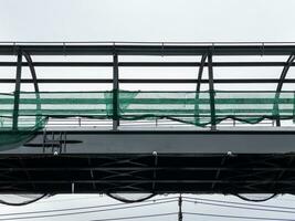 The unfinished metal frame of the sky walks bridge. photo