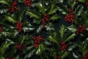 Christmas holly leaves with red berries on dark background. Top view. photo