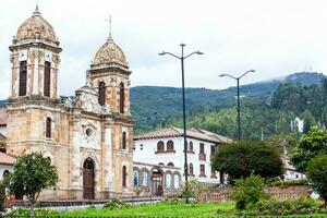 Historical Our Lady of the Rosary Church at the central square of the small town of Tibasosa located in the Boyaca department in Colombia photo