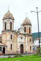 Historical Our Lady of the Rosary Church at the central square of the small town of Tibasosa located in the Boyaca department in Colombia photo