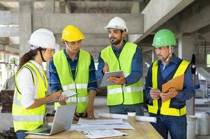 engineering team lead by engineer project manager having a stressful project meeting at the job site over a mistake that is not go according to plan.concept of stress on work,conflict management photo