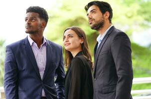 young confident business people standing and looking forward to the future photo