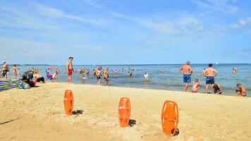 Swinoujscie, Poland. 15 August 2023. Lifeguards with rescue tower on the beach of the Baltic Sea photo