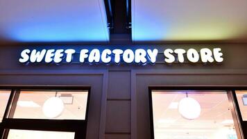 Swinoujscie, Poland. 15 August 2023. Sweet Factory Store sign. photo