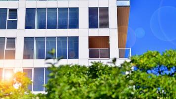 Exterior of a high modern multi-story apartment building - facade, windows and balconies. photo