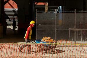 Puebla, Mexico 2023 - Construction workers work to repair a street in the Historic Center of Puebla photo