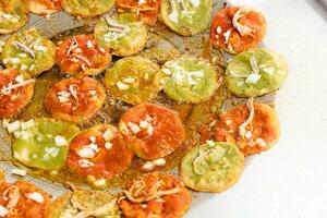 chalupas poblanas submerged in lard, mexican food from the city of Puebla, Mexico photo