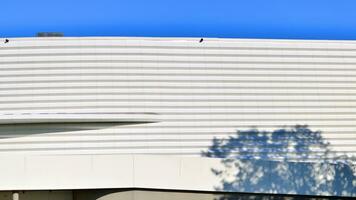 Minimalist photo of an exterior of a modern tin building