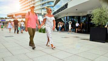 Swinoujscie, Poland. 15 August 2023. The popular beach promenade on the Polish Baltic Sea coast. Tourists walk along the promenade. photo