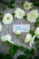 background of many white roses on a light wooden photo