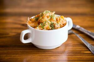 stewed cabbage with carrots and spices in a bowl photo