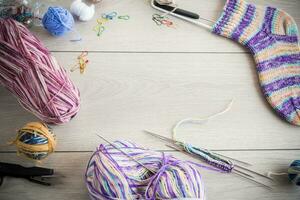 Colored threads, knitting needles and other items for hand knitting photo