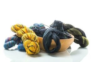 Colored threads, knitting needles and other items for hand knitting photo