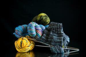 Colored threads, knitting needles and other items for hand knitting photo