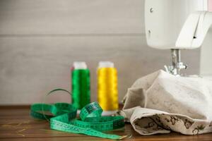 Sewing machine with fabric and threads for sewing, close-up. The working process photo