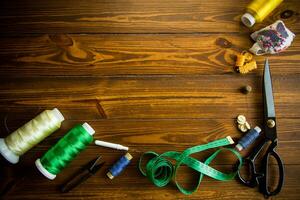a set of tools and threads for sewing clothes photo