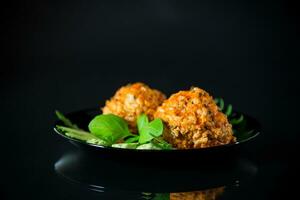 Cooked meatballs in a plate with fresh vegetables photo