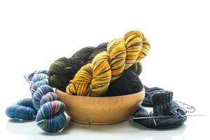 Colored threads, knitting needles and other items for hand knitting photo