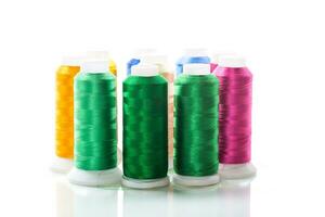 set of different color sewing threads,on white background. photo