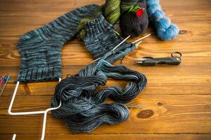 Set for hand knitting warm winter socks made of natural woolen yarn. photo