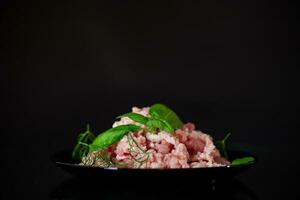 chopped fresh minced pork meat in a plate photo