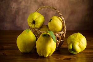 Ripe natural autumn quince on wooden table. photo