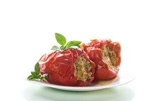 stewed in gravy stuffed peppers in a plate . photo