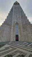 Church of hallgrimur in Iceland circa March 2023, large sacred building representing lutheran monument with holy cross. Majestic nordic cathedral in iceland, holy religious hallgrimskirkja. photo