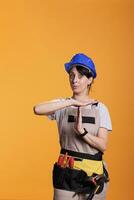 Tired construction worker expressing timeout sign photo