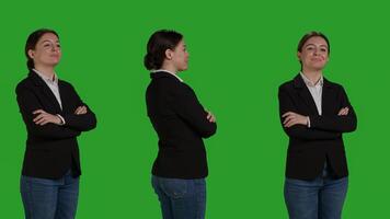 Close up of young accountant wearing formal suit in studio, acting positive and confident over green screen backdrop. Corporate worker being cheerful, company employee smiling on camera. photo