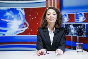 Woman presenter hosting news segment in newsroom, broadcasting live information from around the world. News anchor discussing about latest events on international television network. photo