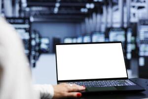 Close up shot of mock up laptop used by specialist in server hub delivering massive computing power, capable of processing and storing large amounts of data and controlling network resources photo