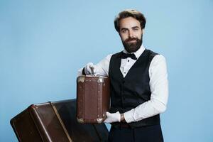 Charismatic bellhop with classic uniform, strikes confident pose against studio background. Professional doorkeeper expressing sense of reliability to provide excellent service and assistance. photo